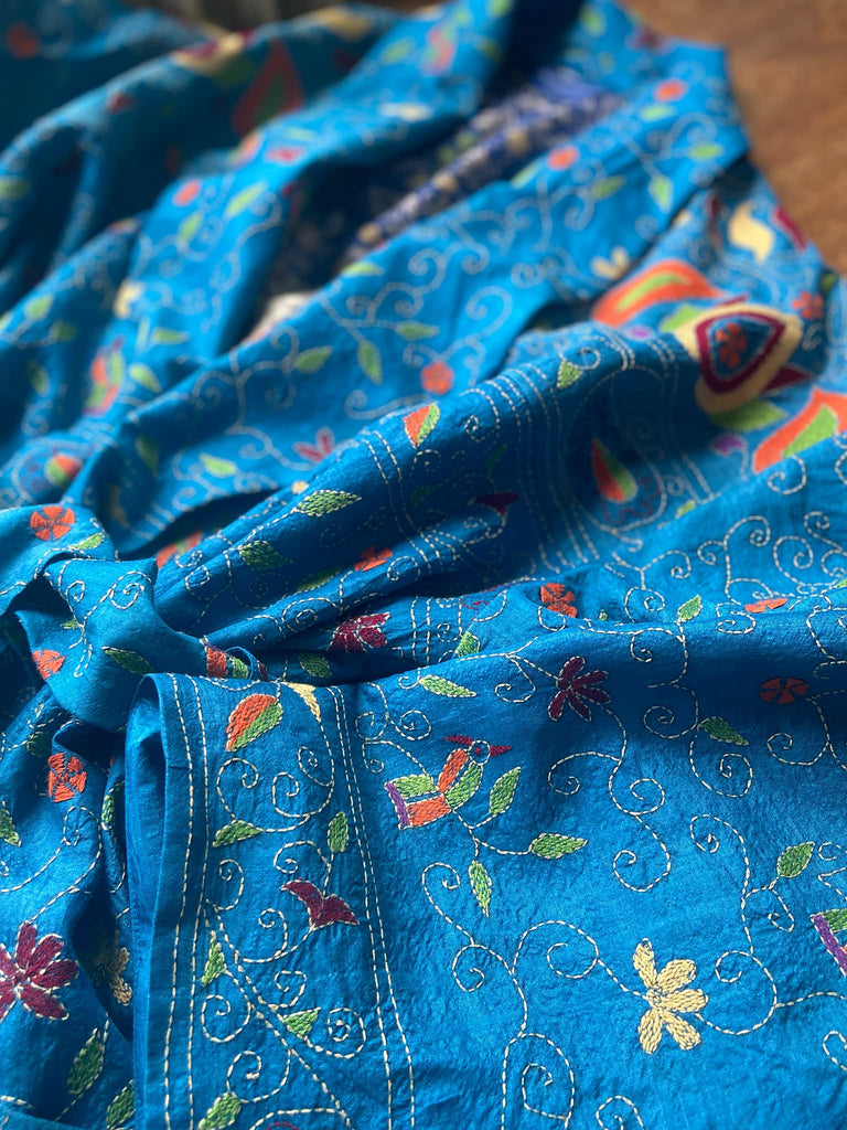 Hand embroidered kantha Royal blue pure silk robe with wide sleeves, tassel sash and patch pockets. Bohemian style created from vintage and antique textiles by Pavilion Parade