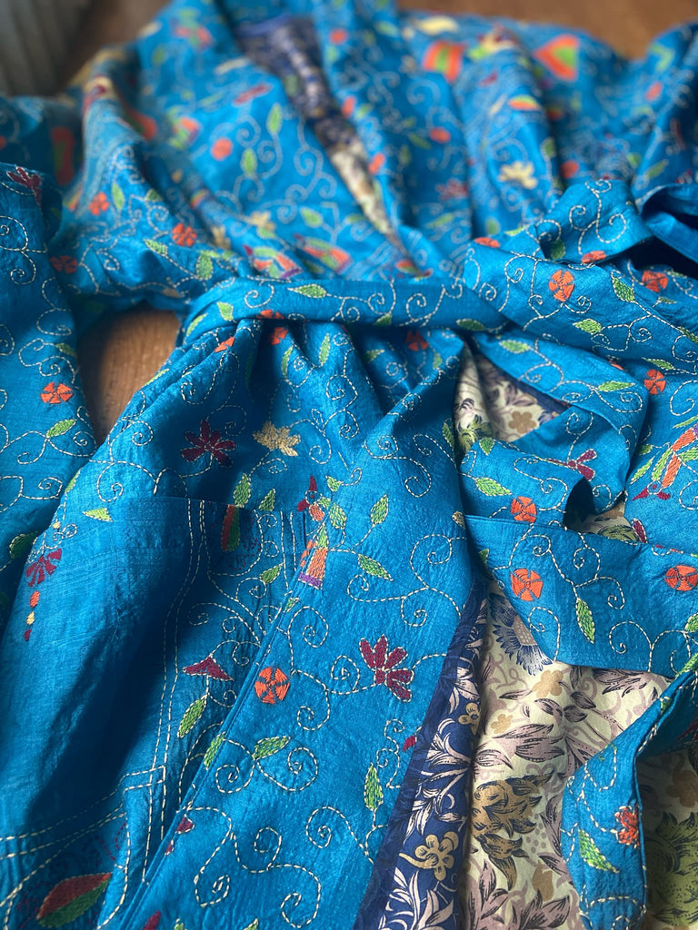 Hand embroidered kantha Royal blue pure silk robe with wide sleeves, tassel sash and patch pockets. Bohemian style created from vintage and antique textiles by Pavilion Parade