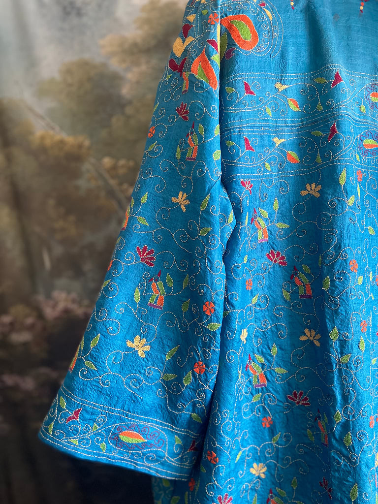 Hand embroidered kantha Royal blue pure silk robe with wide sleeves, tassel sash and patch pockets. Bohemian style created from vintage and antique textiles by Pavilion Parade