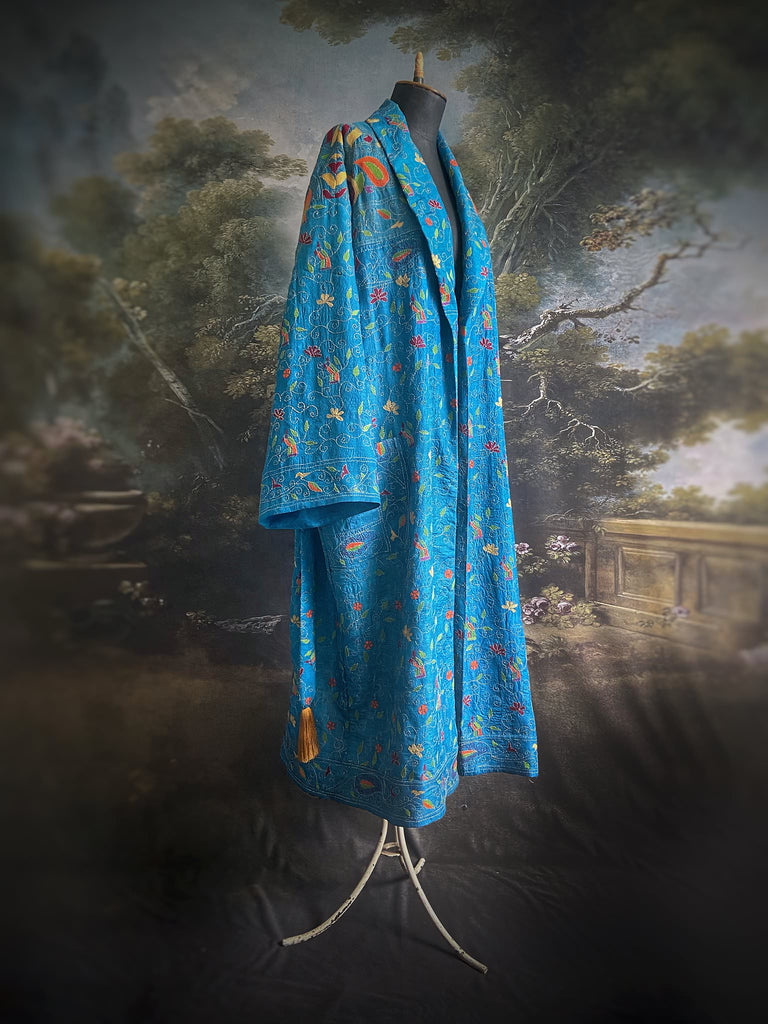Hand embroidered kantha Royal blue pure silk robe with wide sleeves, tassel sash and patch pockets. Bohemian style created from vintage and antique textiles by Pavilion Parade
