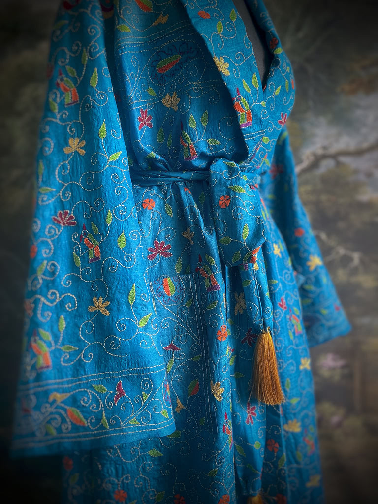 Hand embroidered kantha Royal blue pure silk robe with wide sleeves, tassel sash and patch pockets. Bohemian style created from vintage and antique textiles by Pavilion Parade