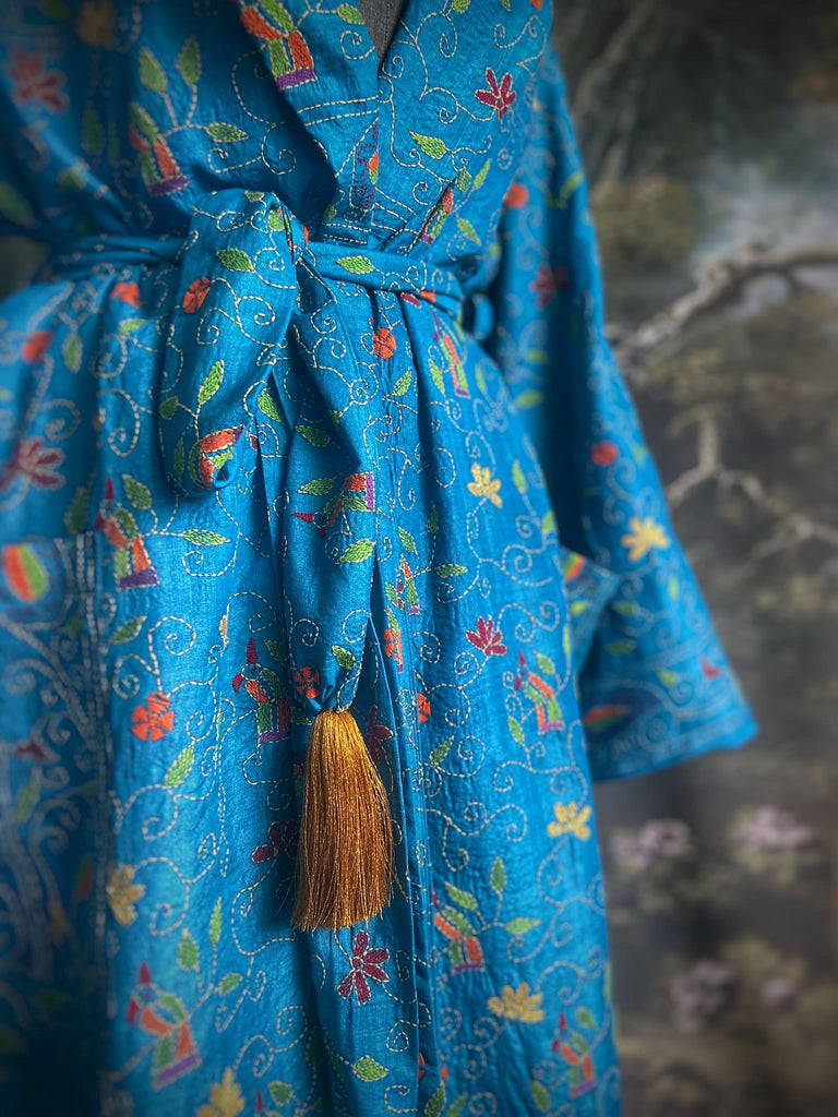 Hand embroidered kantha Royal blue pure silk robe with wide sleeves, tassel sash and patch pockets. Bohemian style created from vintage and antique textiles by Pavilion Parade