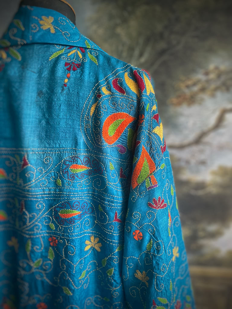 Hand embroidered kantha Royal blue pure silk robe with wide sleeves, tassel sash and patch pockets. Bohemian style created from vintage and antique textiles by Pavilion Parade