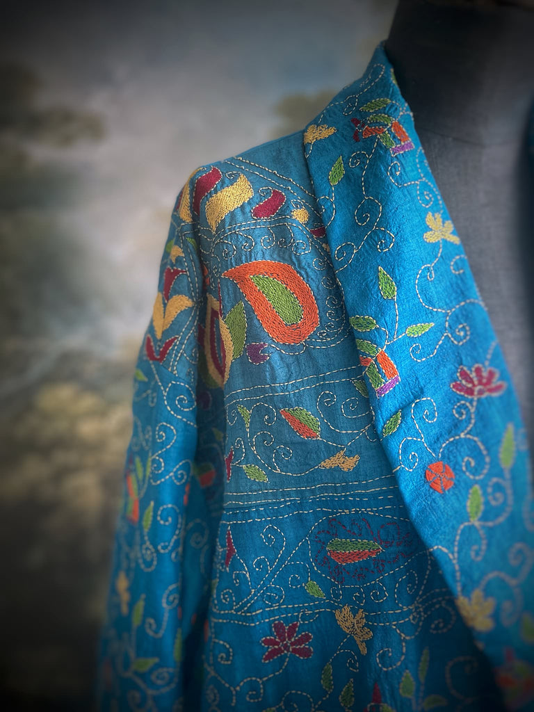 Hand embroidered kantha Royal blue pure silk robe with wide sleeves, tassel sash and patch pockets. Bohemian style created from vintage and antique textiles by Pavilion Parade