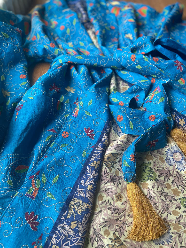Hand embroidered kantha Royal blue pure silk robe with wide sleeves, tassel sash and patch pockets. Bohemian style created from vintage and antique textiles by Pavilion Parade