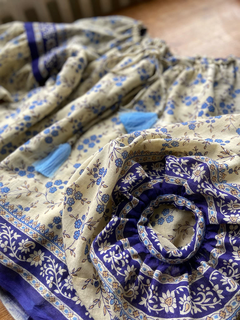 Sky blue and ivory cotton muslin block printed blouse with long full sleeves and adjustable drawstring neckline. Bohemian styles sustainably created from antique and vintage textiles by the Pavilion Parade studio. 