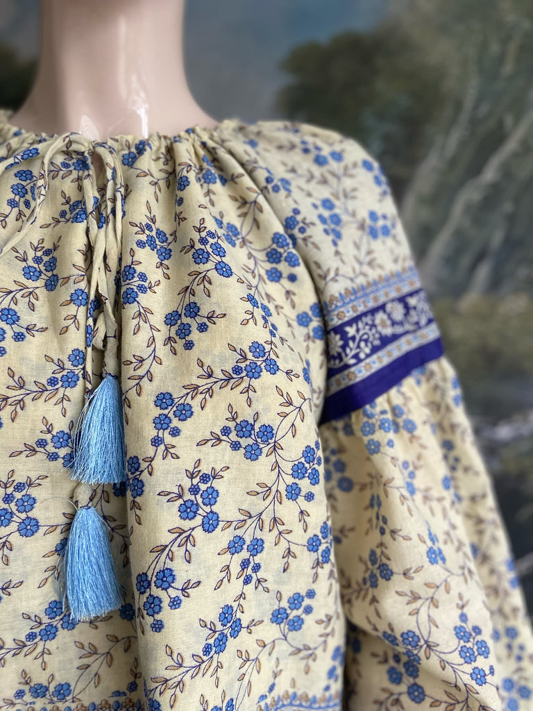 Sky blue and ivory cotton muslin block printed blouse with long full sleeves and adjustable drawstring neckline. Bohemian styles sustainably created from antique and vintage textiles by the Pavilion Parade studio. 