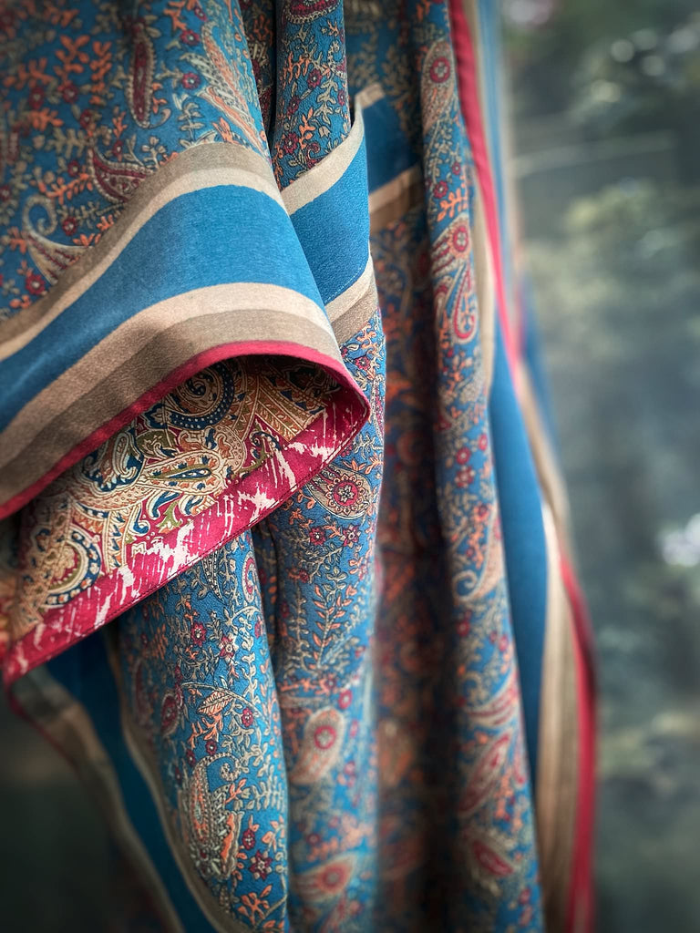 Full length 1920s inspired kimono robe with large patch pockets. Newly created from a blue, red and pumpkin vintage silk crepe. Fully lined in silk with French seams throughout. Bohemian styles sustainably created from antique and vintage textiles by the Pavilion Parade studio.