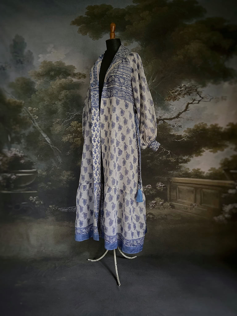 Wedgewood blue and white block printed long dressing robe with bishop sleeves, pockets and tassel sash. Romantic bohemian styles sustainably created from antique and vintage textiles by the Pavilion Parade studio.