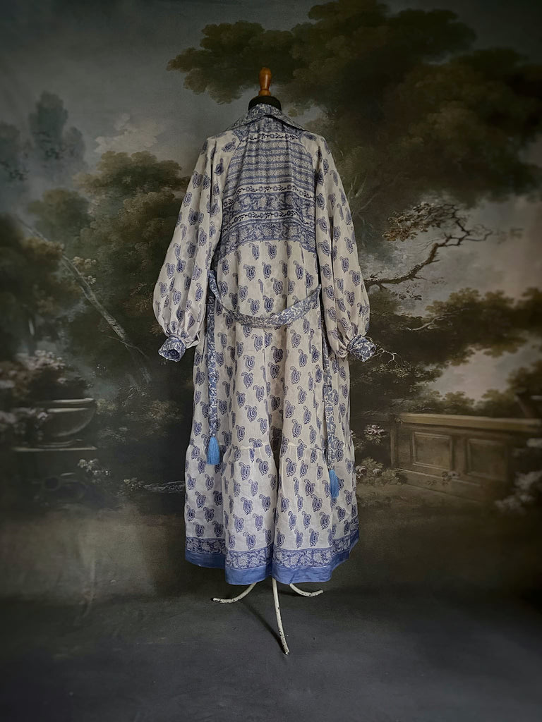 Wedgewood blue and white block printed long dressing robe with bishop sleeves, pockets and tassel sash. Romantic bohemian styles sustainably created from antique and vintage textiles by the Pavilion Parade studio.
