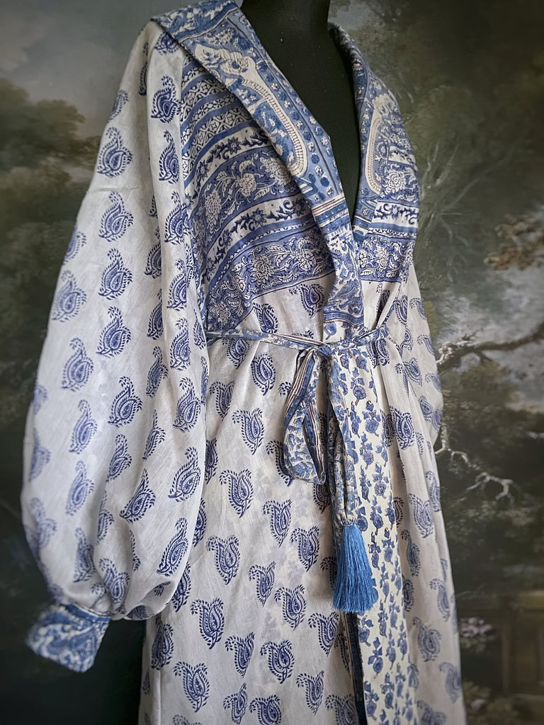 Wedgewood blue and white block printed long dressing robe with bishop sleeves, pockets and tassel sash. Romantic bohemian styles sustainably created from antique and vintage textiles by the Pavilion Parade studio.