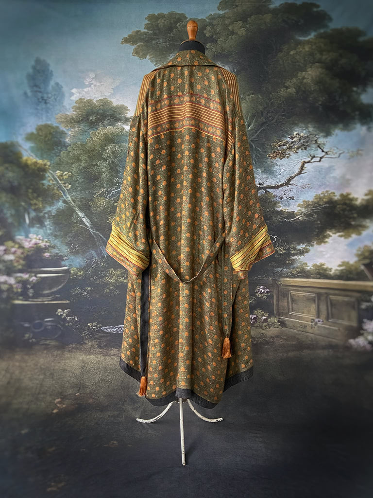 Blue-green and mustard fine wool robe with full silk lining. Wide cuffs, patch pockets and tassel sash. Bohemian style created from antique and vintage textiles by the Pavilion Parade studio.