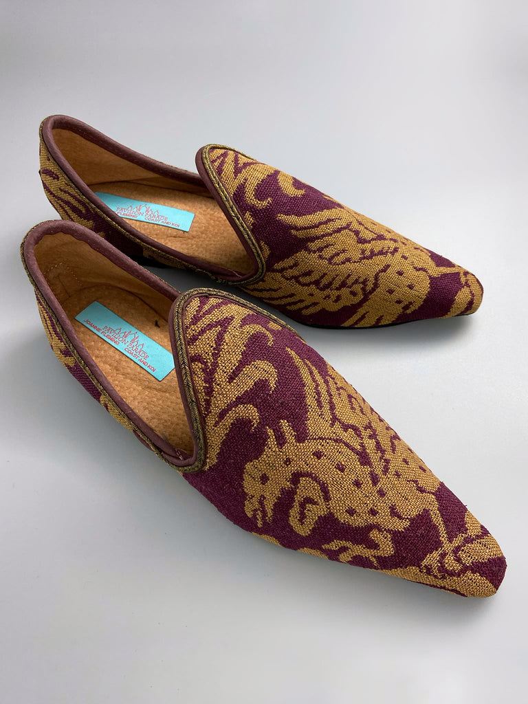 Burgundy red and old gold linen silk brocade pointed toe slipper shoes. Woven dragon or gryphon motifs. Sustainably created from antique textiles from the Pavilion Parade studio.