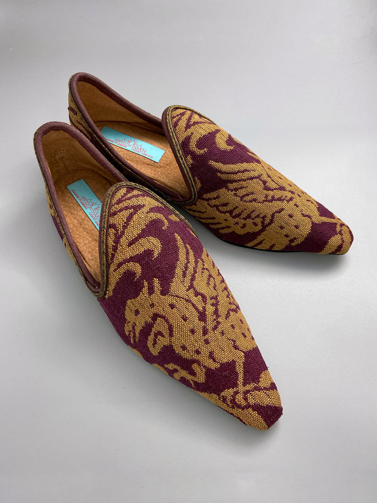 Burgundy red and old gold linen silk brocade pointed toe slipper shoes. Woven dragon or gryphon motifs. Sustainably created from antique textiles from the Pavilion Parade studio.