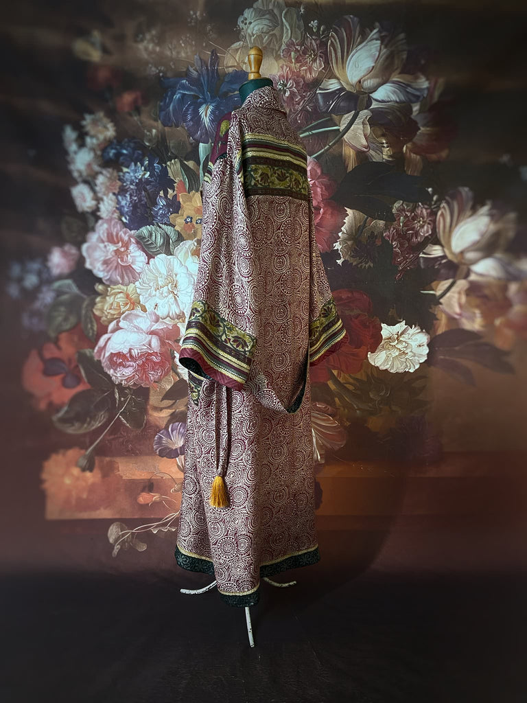 Dark burgundy red, ochre and ivory fine wool luxury dressing robe. Lined in silk and sustainably created from antique and vintage textiles by the Pavilion Parade studio.