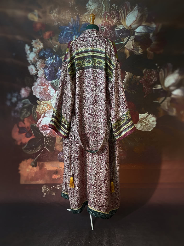 Dark burgundy red, ochre and ivory fine wool luxury dressing robe. Lined in silk and sustainably created from antique and vintage textiles by the Pavilion Parade studio.