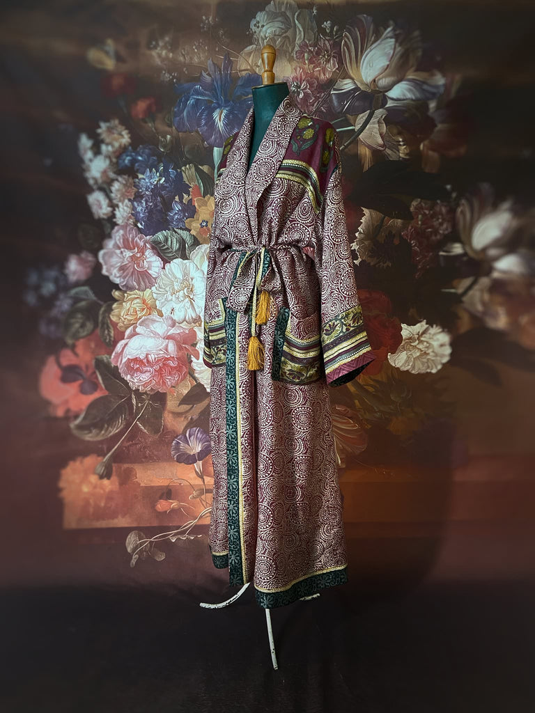 Dark burgundy red, ochre and ivory fine wool luxury dressing robe. Lined in silk and sustainably created from antique and vintage textiles by the Pavilion Parade studio.