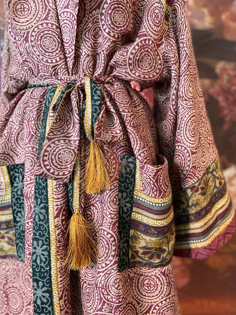 Dark burgundy red, ochre and ivory fine wool luxury dressing robe. Lined in silk and sustainably created from antique and vintage textiles by the Pavilion Parade studio.