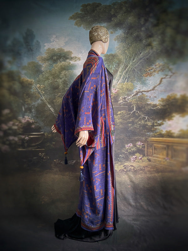 Egyptian Revival 1920s inspired full length robe created from vintage and antique textiles. Lapiz lazuli blue and scarlet silk crepe. Lined in block printed silk with design of ancient Egyptian figures, pyramids, chariots. Bohemian style from Pavilion Parade.