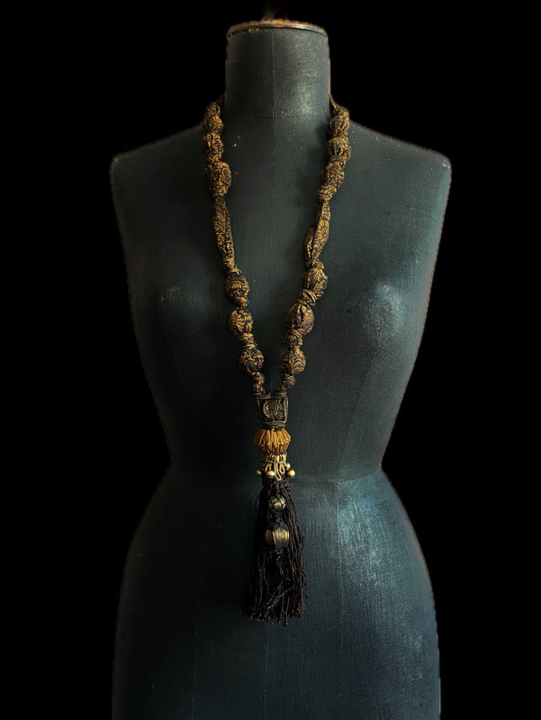 1920s style long silk sautoir necklace with antique tassel embellishment. Bohemian style from vintage textiles by Pavilion Parade. 