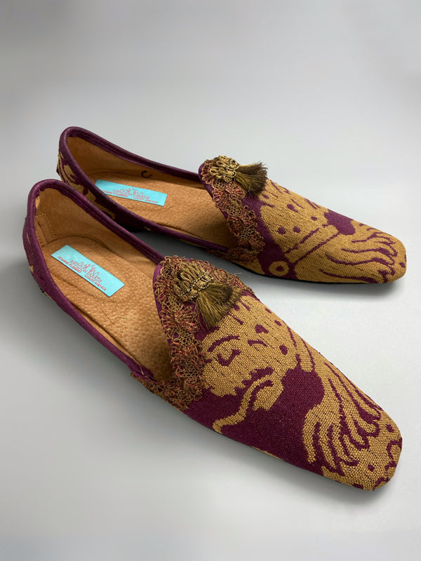 Burgundy red and old gold linen silk brocade slipper shoes. Woven heraldic leopard motifs. Sustainably created from antique textiles from the Pavilion Parade studio.
