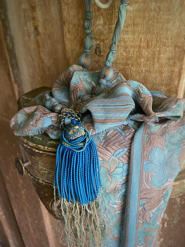1920s style long silk sautoir necklace with antique tassel embellishment. Bohemian style from vintage textiles by Pavilion Parade. 