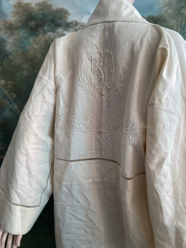 Full length kimono inspired robe with large patch pockets and wide sleeves. Created from an antique heavy French linen trousseau sheet with heirloom embroidery and drawn thread work. All French seamed with hand finished hems and collar. Bohemian styles sustainably created from antique and vintage textiles by the Pavilion Parade studio.
