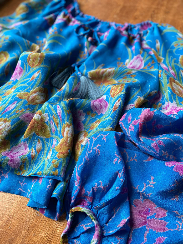 Cerulean blue and rose pink silk georgette blouse with long full sleeves and adjustable drawstring neckline. Bohemian styles sustainably created from antique and vintage textiles by the Pavilion Parade studio. 