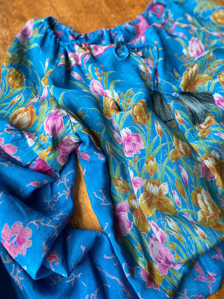 Cerulean blue and rose pink silk georgette blouse with long full sleeves and adjustable drawstring neckline. Bohemian styles sustainably created from antique and vintage textiles by the Pavilion Parade studio. 