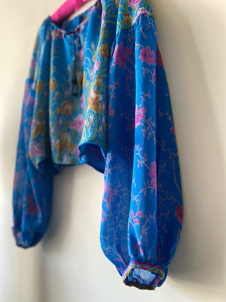 Cerulean blue and rose pink silk georgette blouse with long full sleeves and adjustable drawstring neckline. Bohemian styles sustainably created from antique and vintage textiles by the Pavilion Parade studio. 