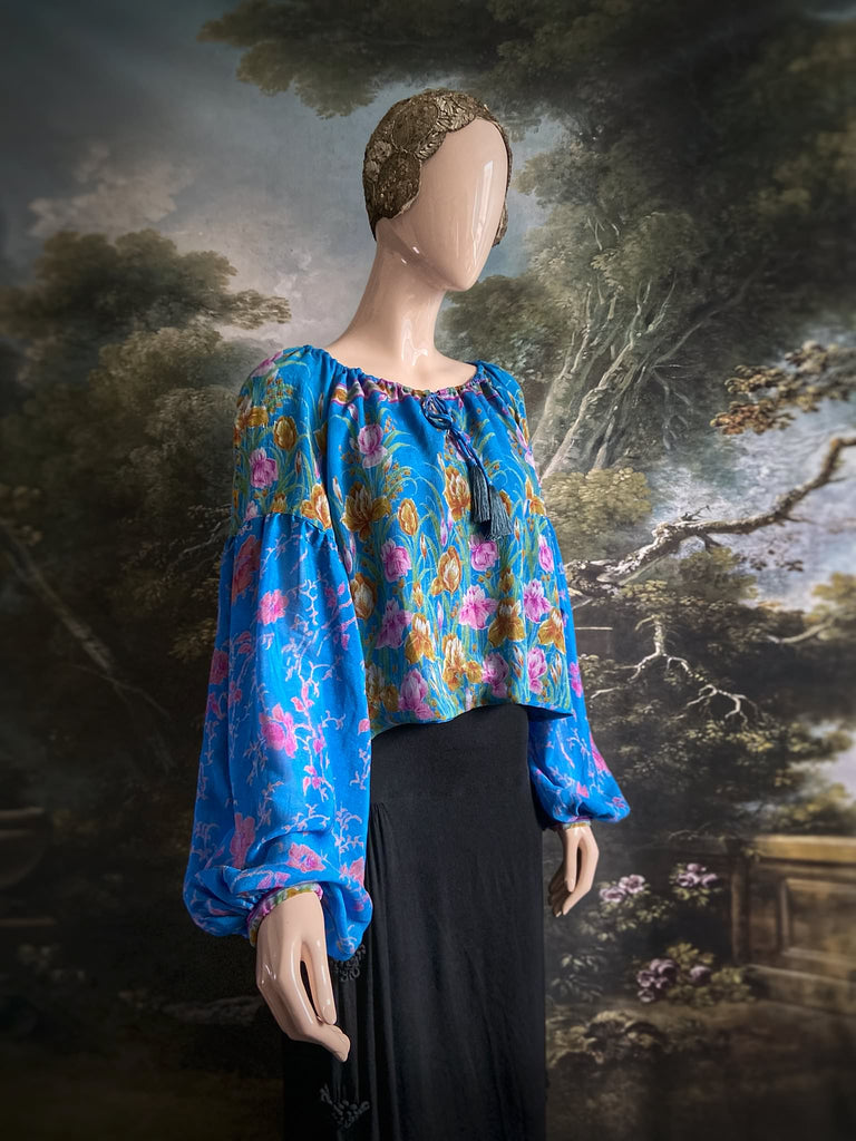 Cerulean blue and rose pink silk georgette blouse with long full sleeves and adjustable drawstring neckline. Bohemian styles sustainably created from antique and vintage textiles by the Pavilion Parade studio. 
