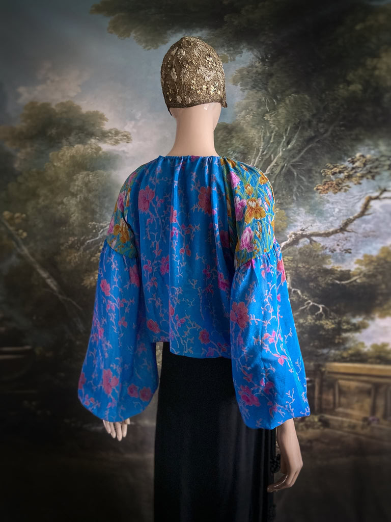 Cerulean blue and rose pink silk georgette blouse with long full sleeves and adjustable drawstring neckline. Bohemian styles sustainably created from antique and vintage textiles by the Pavilion Parade studio. 