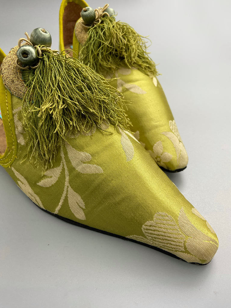Green chartreuse silk damask pointed toe shoes with tassel fringe and gold Ottoman embroidered crescents. Bohemian styles sustainably created from antique textiles by the Pavilion Parade studio. 