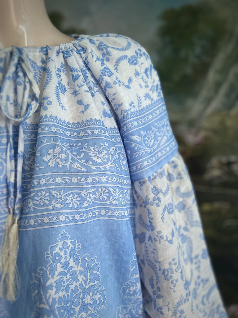 China blue and white cotton muslin block printed blouse with long full sleeves and adjustable drawstring neckline. Bohemian styles sustainably created from antique and vintage textiles by the Pavilion Parade studio. 