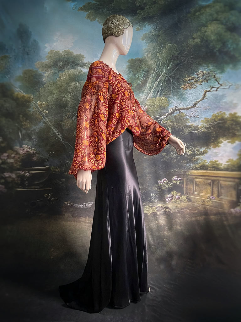 Cinnamon and saffron silk georgette blouse with long full sleeves and adjustable drawstring neckline. Bohemian styles sustainably created from antique and vintage textiles by the Pavilion Parade studio. 