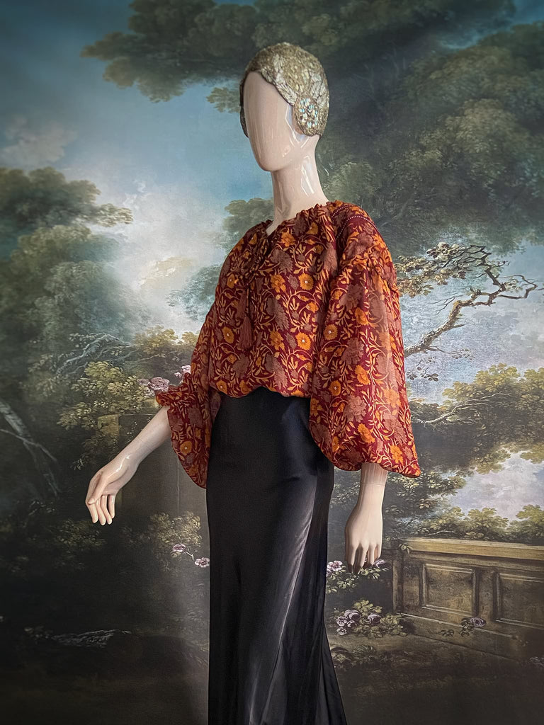 Cinnamon and saffron silk georgette blouse with long full sleeves and adjustable drawstring neckline. Bohemian styles sustainably created from antique and vintage textiles by the Pavilion Parade studio. 