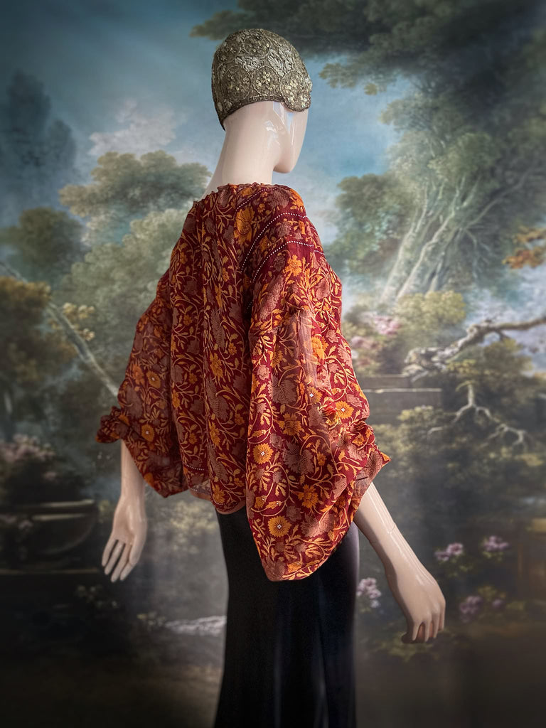 Cinnamon and saffron silk georgette blouse with long full sleeves and adjustable drawstring neckline. Bohemian styles sustainably created from antique and vintage textiles by the Pavilion Parade studio. 