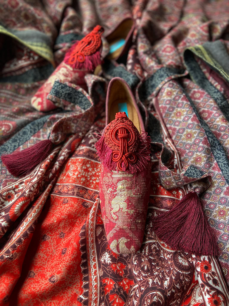 Rosewood fine wool dressing robe with silk lining and tassel sash. Red silk lion rampant brocade shoes. Bohemian style created from vintage textiles by Pavilion Parade 