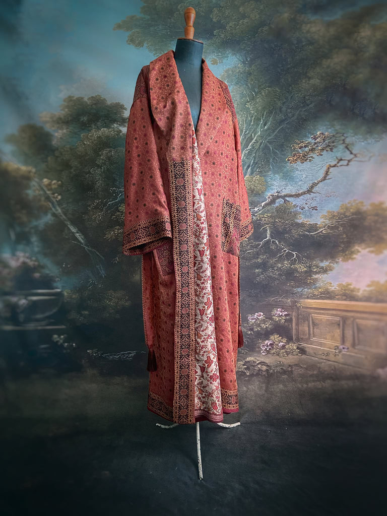 Cinnamon, pumpkin, and soot silk and wool robe with wide sleeves, tassel sash, and deep pockets. Unique bohemian styles sustainably created from vintage textiles by the Pavilion Parade studio.