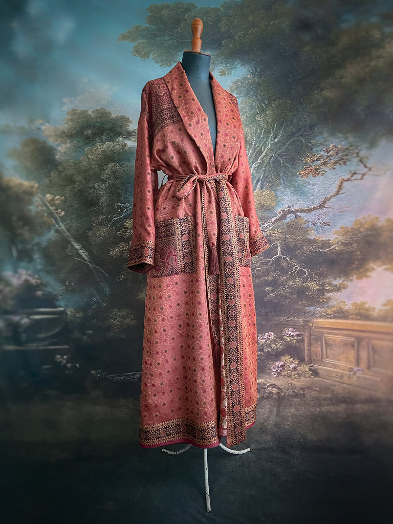 Cinnamon, pumpkin, and soot silk and wool robe with wide sleeves, tassel sash, and deep pockets. Unique bohemian styles sustainably created from vintage textiles by the Pavilion Parade studio.