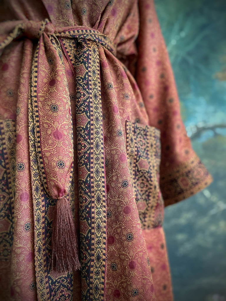 Cinnamon, pumpkin, and soot silk and wool robe with wide sleeves, tassel sash, and deep pockets. Unique bohemian styles sustainably created from vintage textiles by the Pavilion Parade studio.