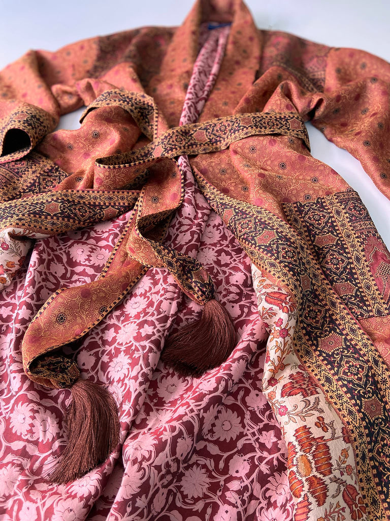 Cinnamon, pumpkin, and soot silk and wool robe with wide sleeves, tassel sash, and deep pockets. Unique bohemian styles sustainably created from vintage textiles by the Pavilion Parade studio.
