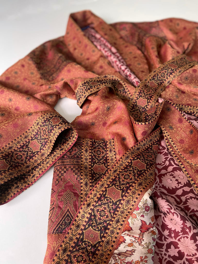 Cinnamon, pumpkin, and soot silk and wool robe with wide sleeves, tassel sash, and deep pockets. Unique bohemian styles sustainably created from vintage textiles by the Pavilion Parade studio.