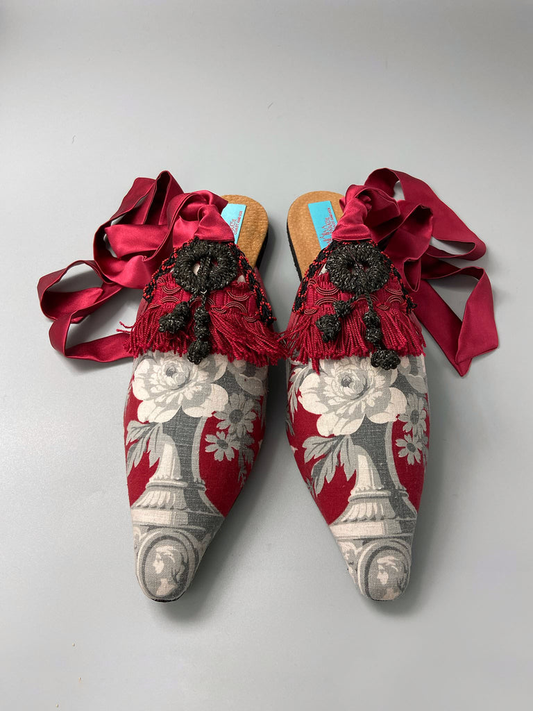 Grisaille classical motifs on crimson toile pointed toe shoes with black and grey Victorian tassel embellishment. Bohemian style sustainably created from antique textiles by the Pavilion Parade studio.