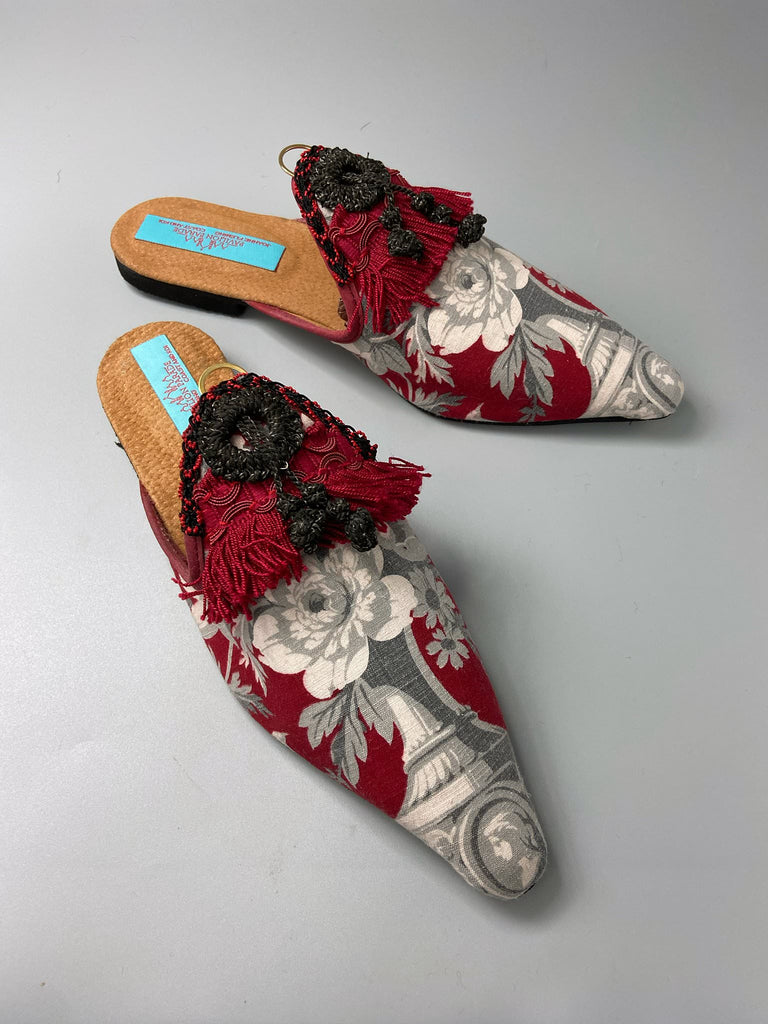 Grisaille classical motifs on crimson toile pointed toe shoes with black and grey Victorian tassel embellishment. Bohemian style sustainably created from antique textiles by the Pavilion Parade studio.