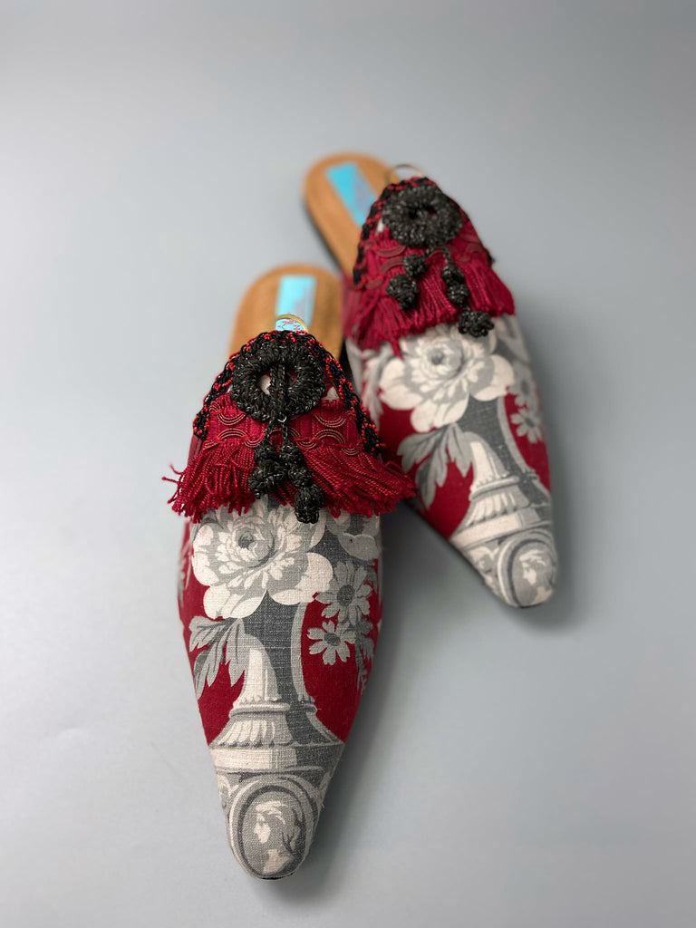 Grisaille classical motifs on crimson toile pointed toe shoes with black and grey Victorian tassel embellishment. Bohemian style sustainably created from antique textiles by the Pavilion Parade studio.