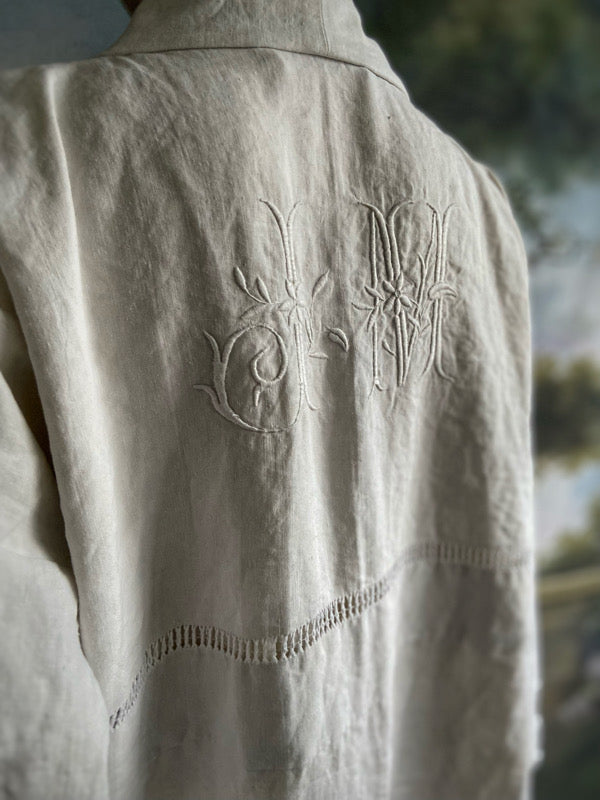 Full length kimono inspired robe with large patch pockets and wide sleeves. Created from an antique heavy French linen trousseau sheet with heirloom embroidery and drawn thread work. All French seamed with hand finished hems and collar. Bohemian styles sustainably created from antique and vintage textiles by the Pavilion Parade studio.
