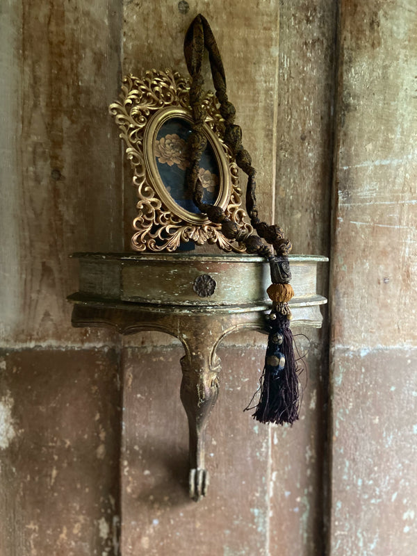 1920s style long silk sautoir necklace with antique tassel embellishment. Bohemian style from vintage textiles by Pavilion Parade. 