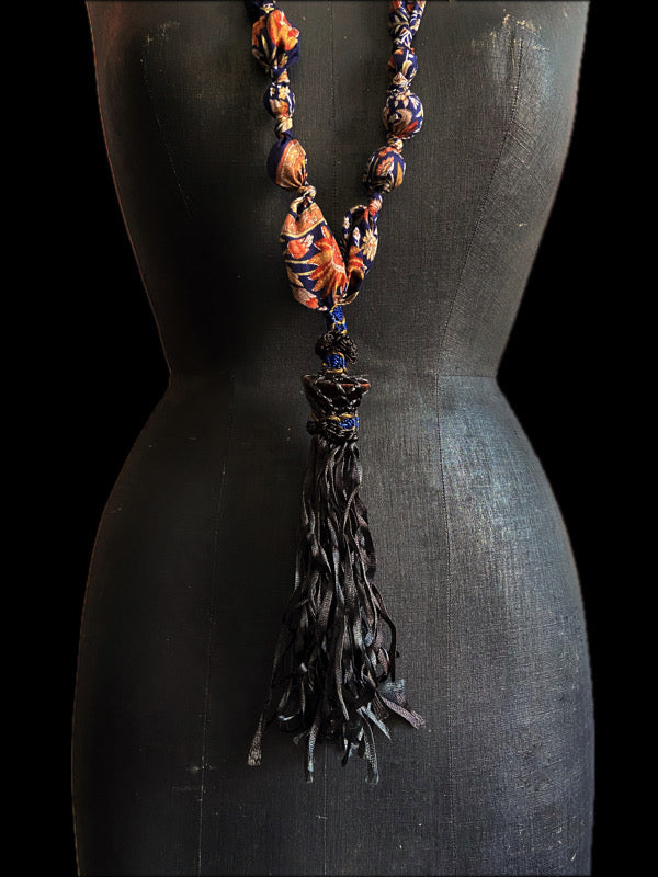 1920s style long silk sautoir necklace with antique tassel embellishment. Bohemian style from vintage textiles by Pavilion Parade. 