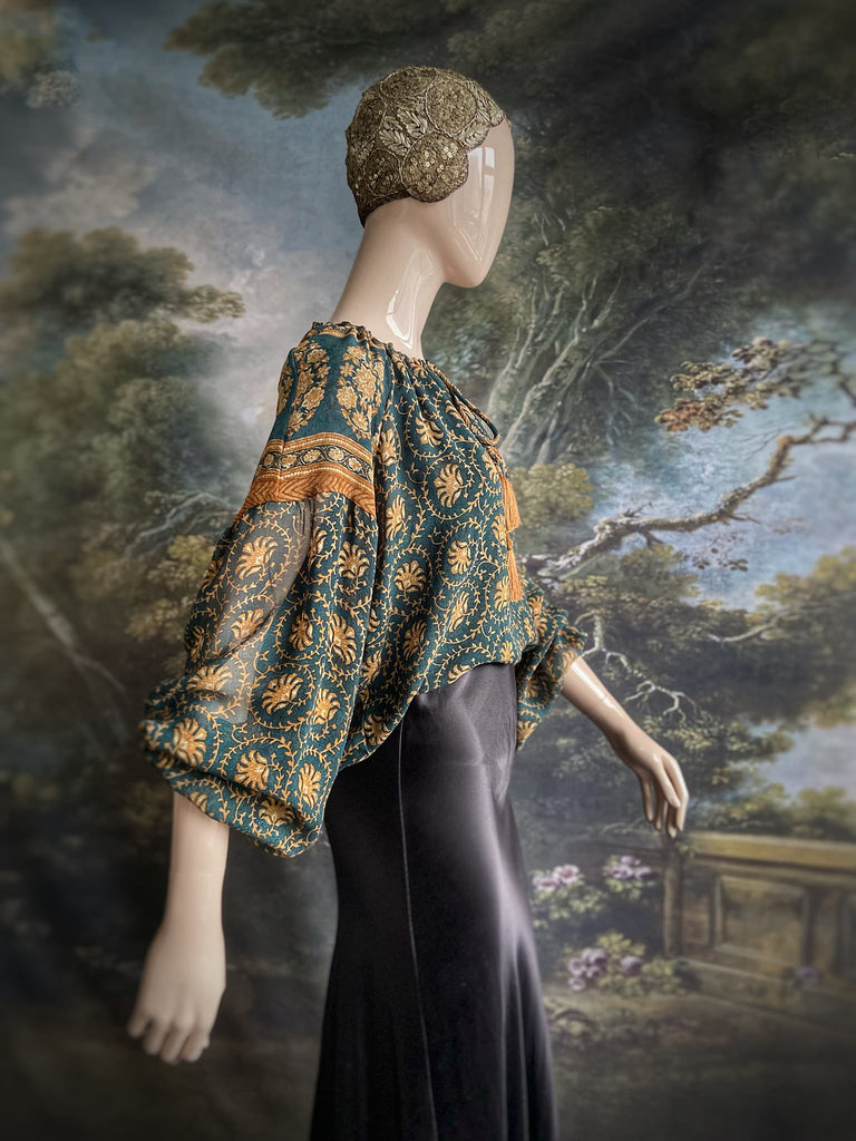 Dark teal green and ochre silk georgette blouse with long full sleeves and adjustable drawstring neckline. Bohemian styles sustainably created from antique and vintage textiles by the Pavilion Parade studio. 